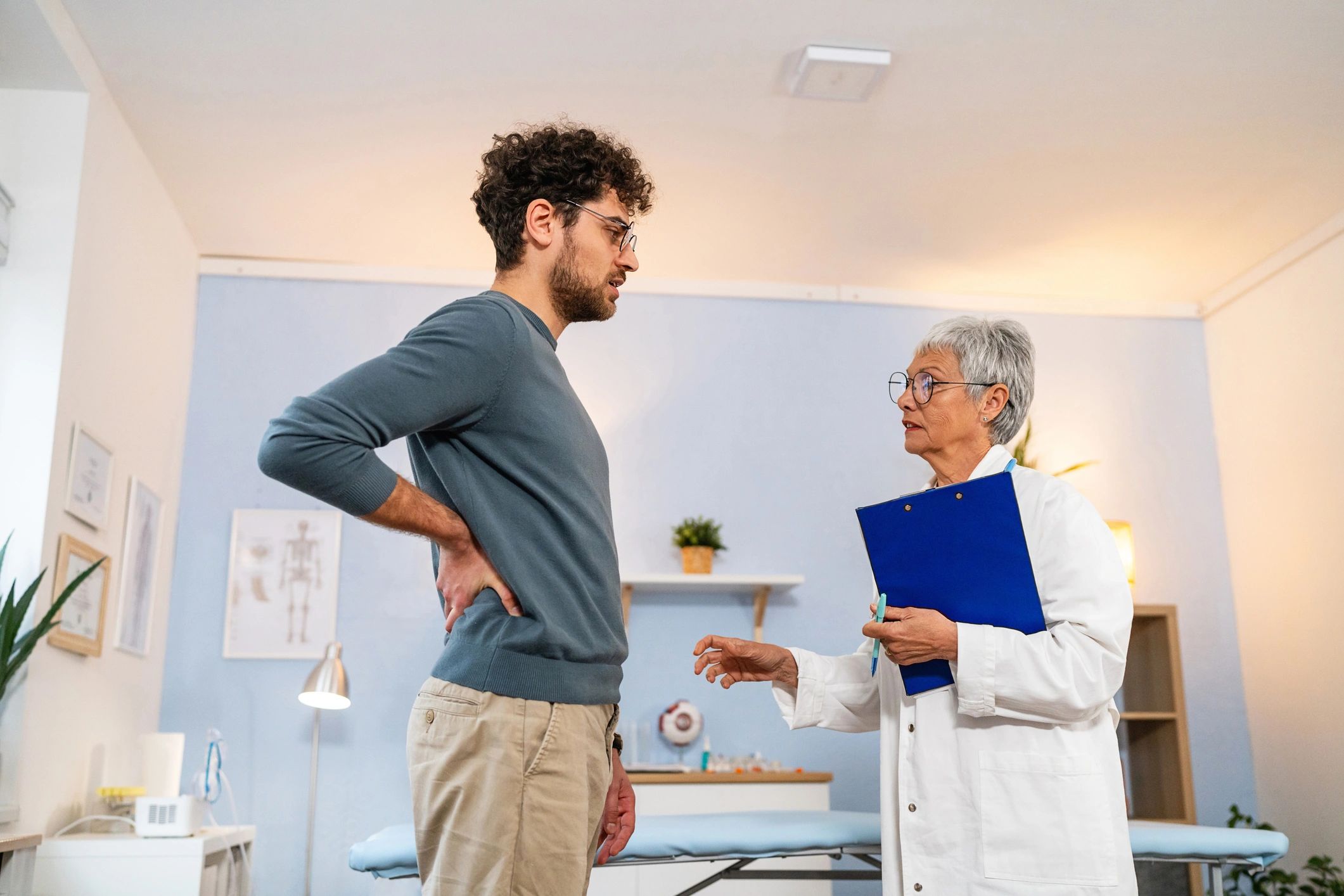 Patient describing symptoms to a physician during a consultation
