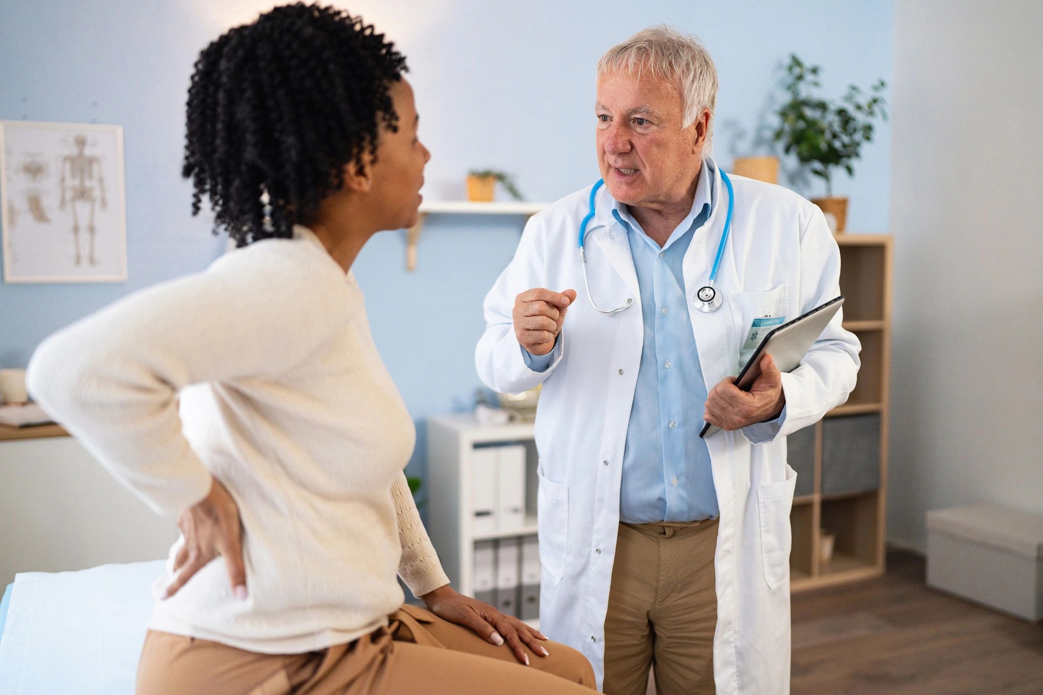 Patient speaking with a doctor during a pain management visit