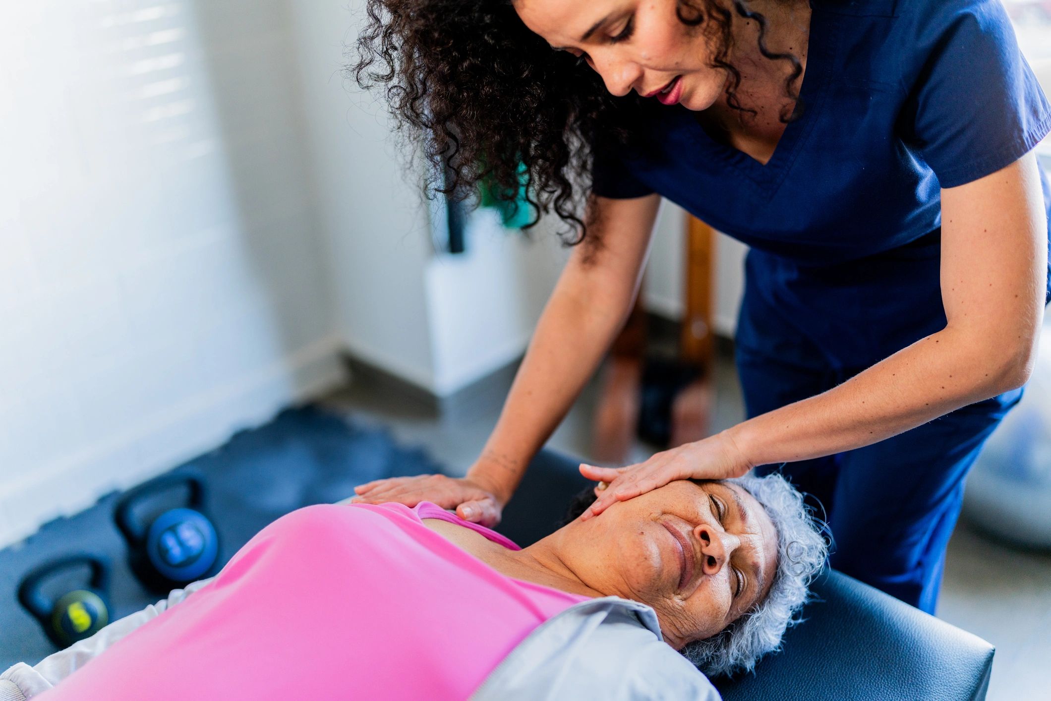 Patient receiving hands-on therapy in a clinic