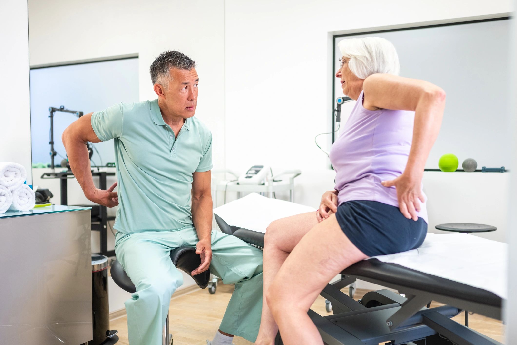 Doctor speaking with a patient during a clinic visit